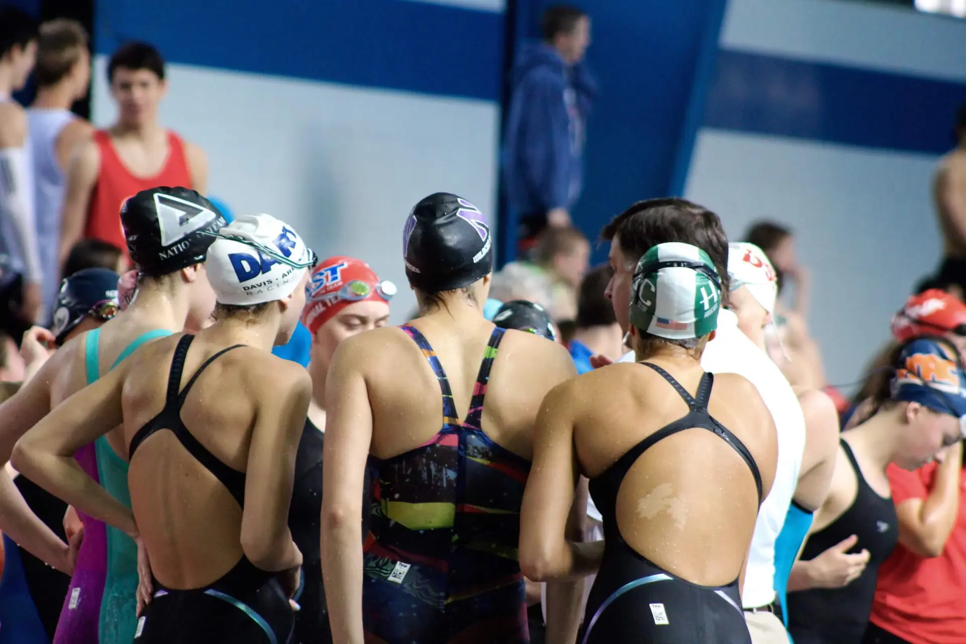 Swimmers of all ages and levels at a swim meet